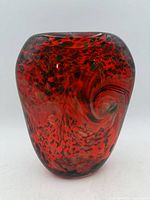 Front view of red art glass vase