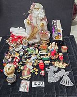 full lot overview displaying Santa figure, ornaments, gift bags, tin