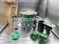 Overall lot showing Guinness bucket, glasses, wine bag, LED cubes, cooler, sunglasses, stoppers and opener
