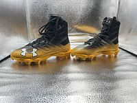 Full view of both cleats side by side showing gradient color and upper design