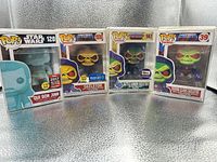 All four boxed Funko Pop figures front view