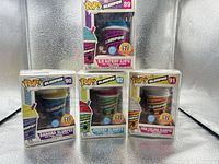 Front view of all four boxed Funko Pop! Slurpee figures