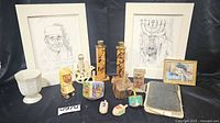Group shot of entire lot showing prints, goblet, candlesticks, dreidels, banks, figure, wall piece, book and block