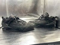 Side view of both sneakers showing overall design and wear