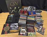 Overview showing box sets and multiple stacks of CDs