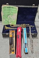 Overall lot: trumpet in case, flute parts, two recorders, cleaning rod, method book