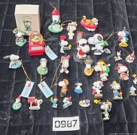 Full group of Snoopy ornaments, box, and snow globe
