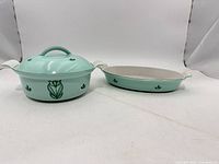 Casserole with lid and oval baking dish side by side