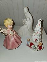 Group shot showing angel, Madonna and Child, and Christmas tree figurines