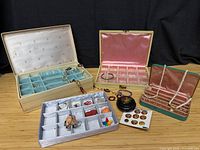 All five jewelry boxes open with visible costume jewelry pieces