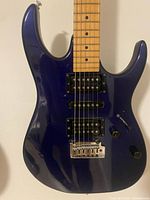 Front view of jewel blue Ibanez RX guitar showing body, pickups, bridge and controls