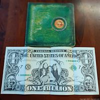Front of folded One Billion Dollar insert with album visible