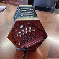 Full view showing hexagonal wood ends, bellows and buttons