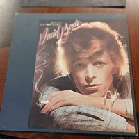 Front album cover showing David Bowie portrait and title