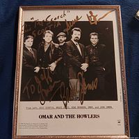 Full framed signed photo showing band and signatures