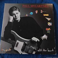 Front cover of Paul McCartney All the Best! gatefold album showing artist holding bass guitar