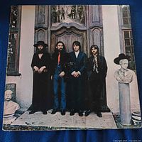 Front sleeve showing band posed in front of doorway