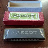 Mascot harmonica front view with box lid and base