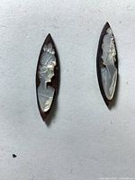 Front view of both navette mother of pearl cameos