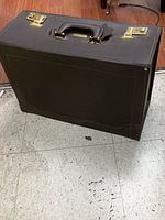 Front/side view of brown leather Stradellina briefcase