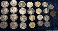 All 26 coins obverse side on dark background