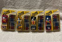 Front view of all four sealed Buss Fuse promotional NASCAR die-cast cars