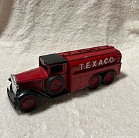 Left side view of red Texaco tanker coin bank