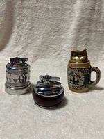 All three lighters side by side showing size, design and material differences