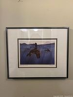 Frontal view of framed print showing artwork, matting and frame