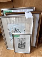 Stack of five framed artworks showing sizes 8"x10" to 13"x19"