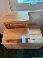 Blanket chest with two-step stool placed on top