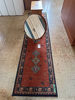 Runner rug, wood table and round mirror overview