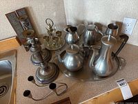 Overview of coffee set, candlesticks, wall sconces, cordial set