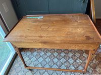 Top view of wooden tea trolley showing overall design and wear marks