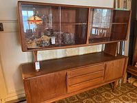 Front view of complete china cabinet showing upper hutch and lower sideboard