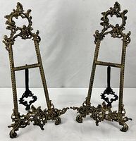 Front view of matching ornate brass easels