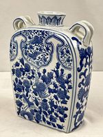 Front view of porcelain moon flask showing phoenix and peony design