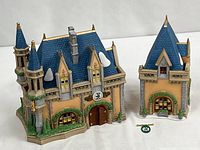 Front view of both porcelain Fantasyland buildings