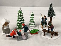 All nine porcelain pieces from both accessory sets displayed together