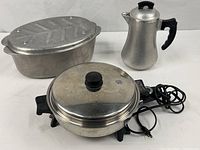 Group shot of coffee pot, roaster, Saladmaster skillet with cord