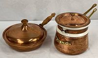 Both cookware pieces side by side showing overall form and lids