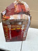 Retail box showing image and capacity details of glass beverage dispenser