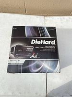 Front of sealed DieHard 12V battery charger retail box
