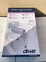 Front of sealed Drive Medical shower chair box showing product image and features