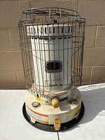 Front view showing full heater with safety cage and controls