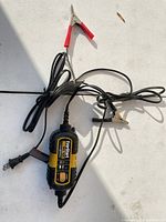 Full view of EverStart Maxx charger with AC cord and clamp leads