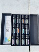 Box open showing twelve Onepure essential oil bottles and information leaflet