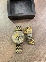 Front view of watch, bracelet, and box