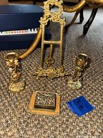 Front view of easel, two candlesticks, trinket box