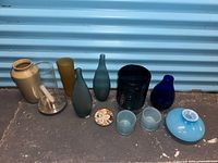 Group shot showing all vases, tumblers, coaster and candle holder